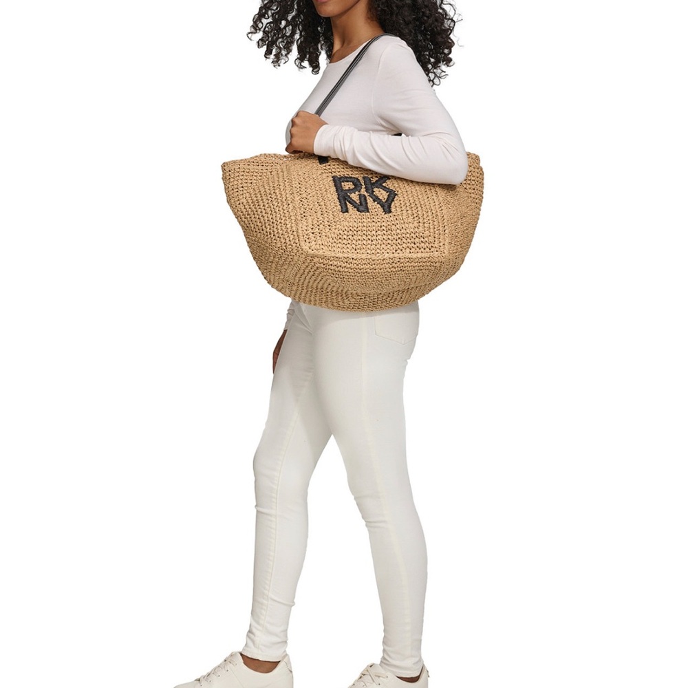 New This packable DKNY tote is perfect for daytime trips to the beach, pool,